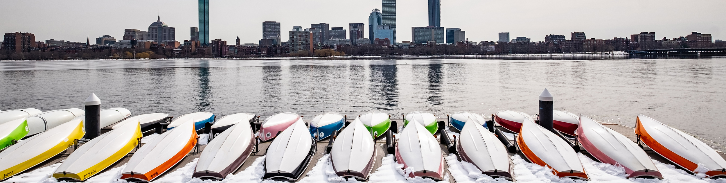 image of a group of snowy boats parked on Boston Harbor