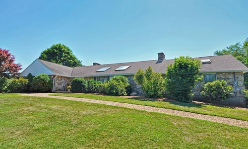 Detached Stone Ranch - exterior view with lots of shrubbery