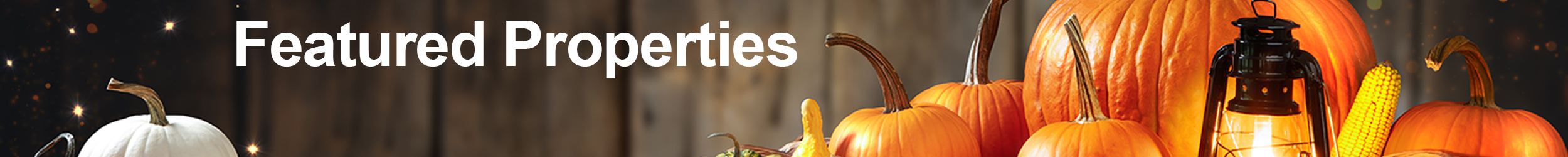 Featured Properties banner with pumpkins, corn and a lantern in the background