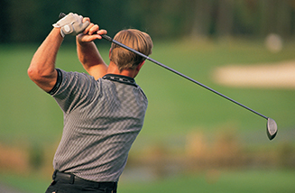 Man Swinging a Golf Club