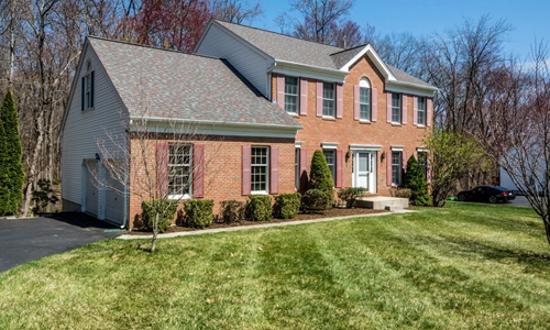 21 Hemingway Street Shrewsbury, MA 01545 Four bedroom colonial home in Westborough MA - brick front with white trim, white door and red shutters