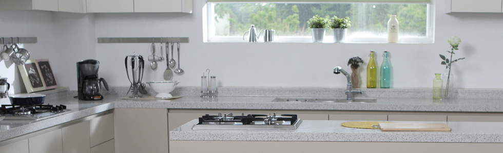bright white and gray kitchen with window over sink