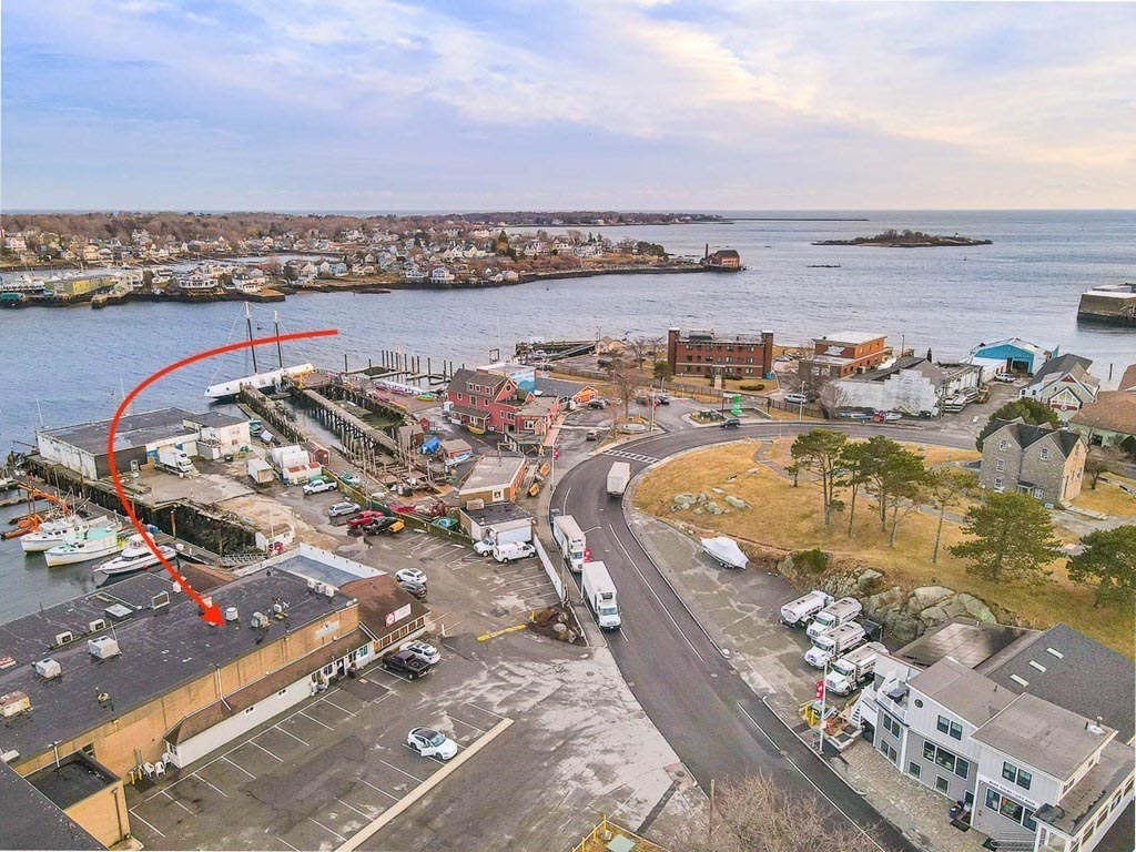 a red arrow is pointing to the location of the restaurant for sale in Gloucester Harbor Loop