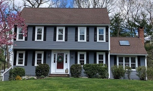 Detached Grey Colonial for sale in Hanover, MA - exterior of home shown